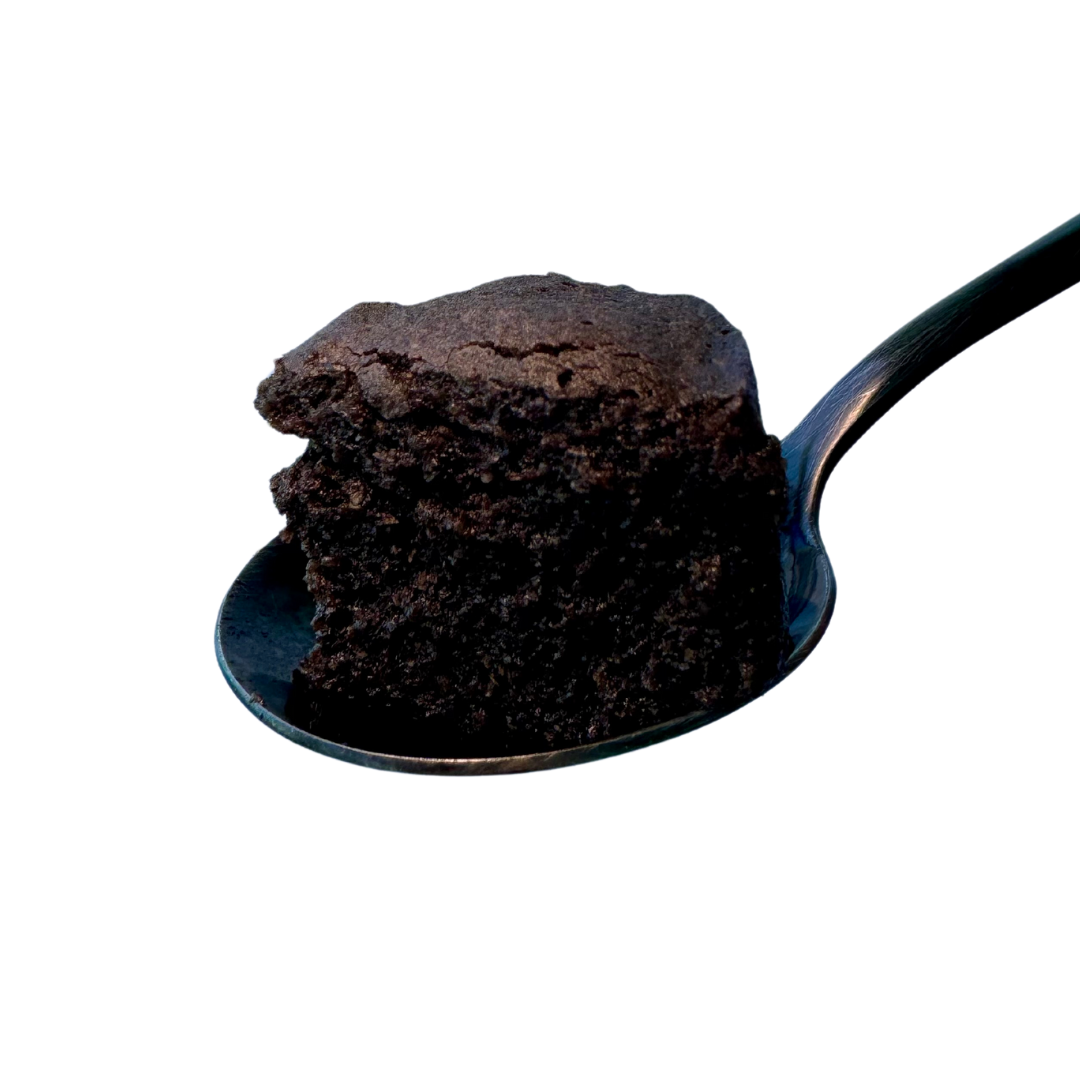 Slice of black sesame mochi cake on a black spoon